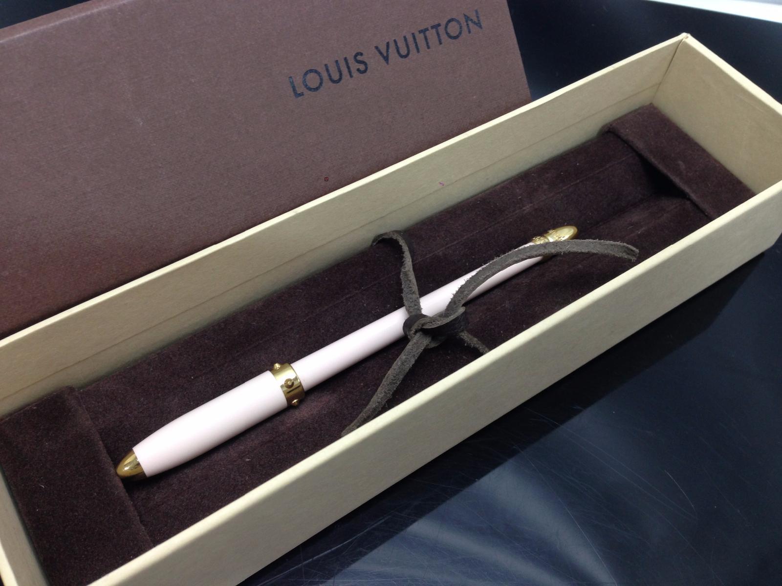 LOT:1183  (110686) A louis Vuitton pen, the gold and enamel pen  accompanied by makers case